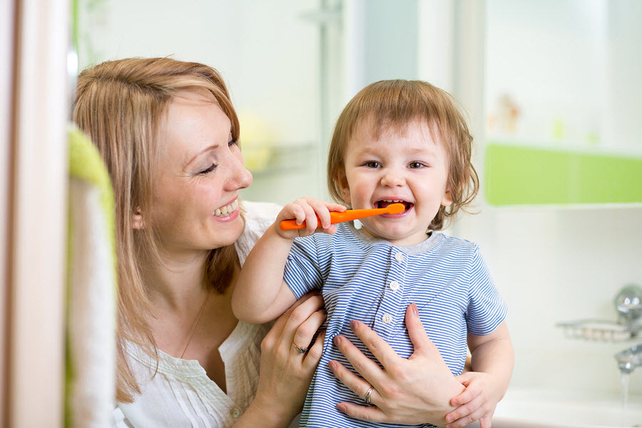 mother-teaching-child-to-brush-teeth